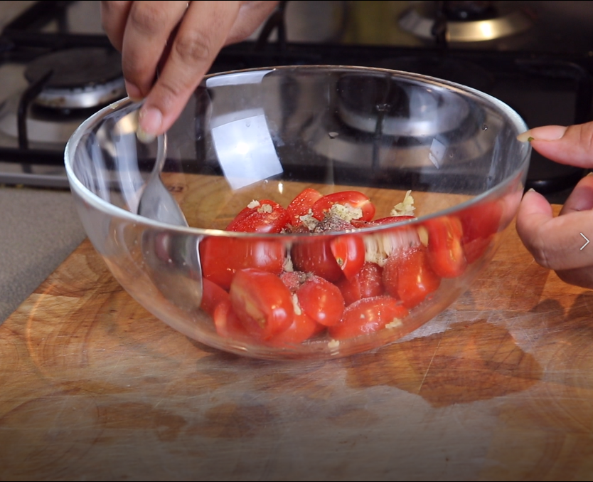 mixing tomatoes